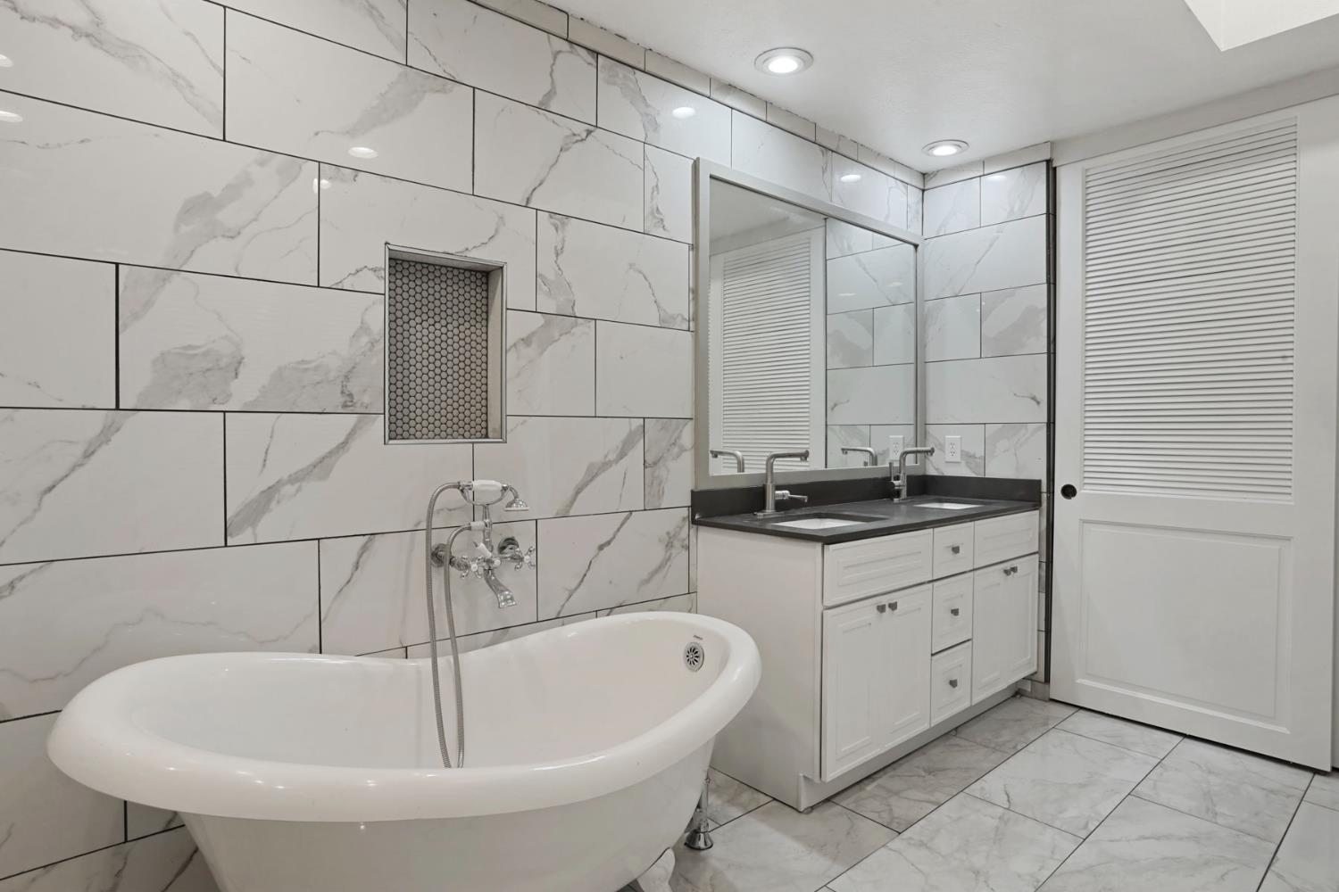 1917 Edgebrook Drive, Unit D Modesto, CA 95354 - Photo 35 of 58 a bathroom with a bathtub and sink