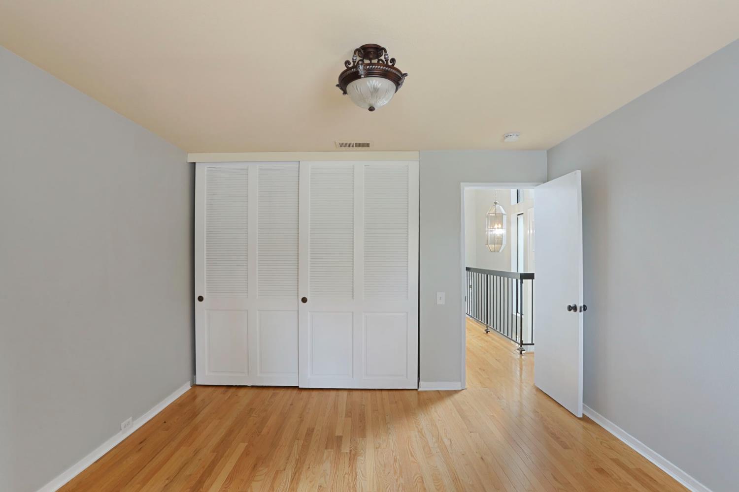 1917 Edgebrook Drive, Unit D Modesto, CA 95354 - Photo 40 of 58 a view of empty room with wooden floor