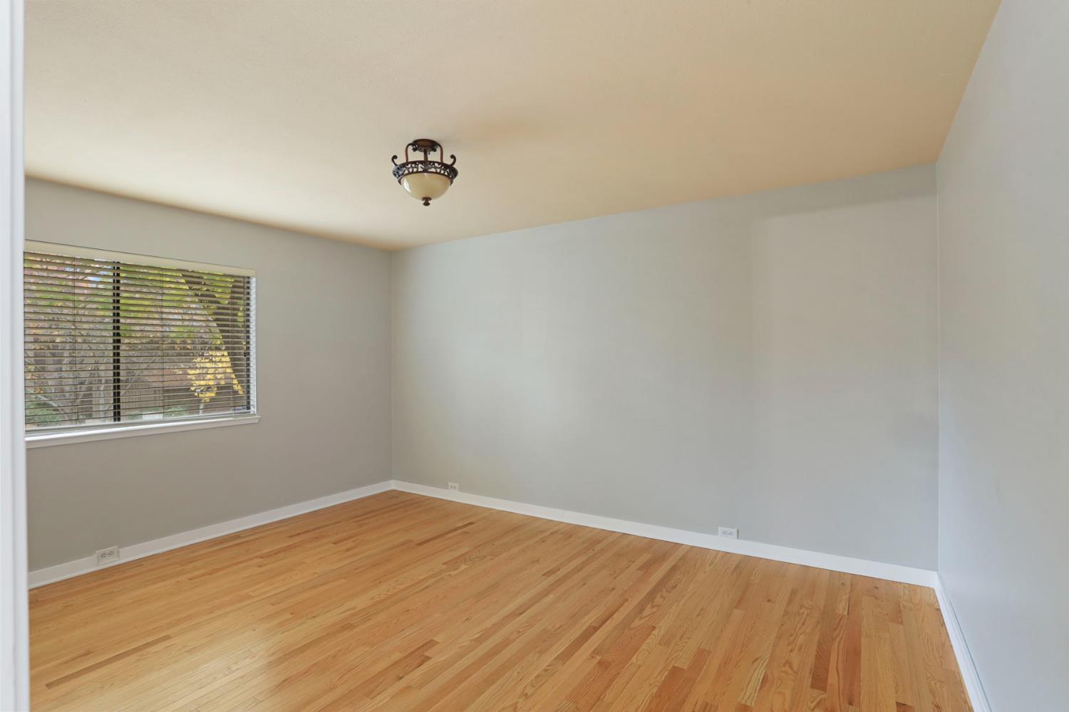 1917 Edgebrook Drive, Unit D Modesto, CA 95354 - Photo 41 of 58 an empty room with a window