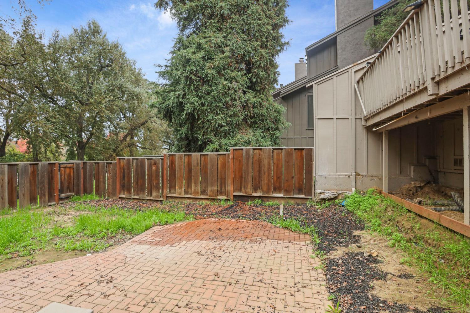 1917 Edgebrook Drive, Unit D Modesto, CA 95354 - Photo 52 of 58 a backyard of a house with lots of green space
