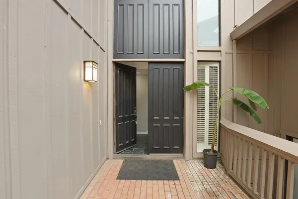 a view of a house with a door and wooden floor