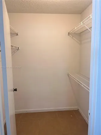 a view of small space with racks on the wall