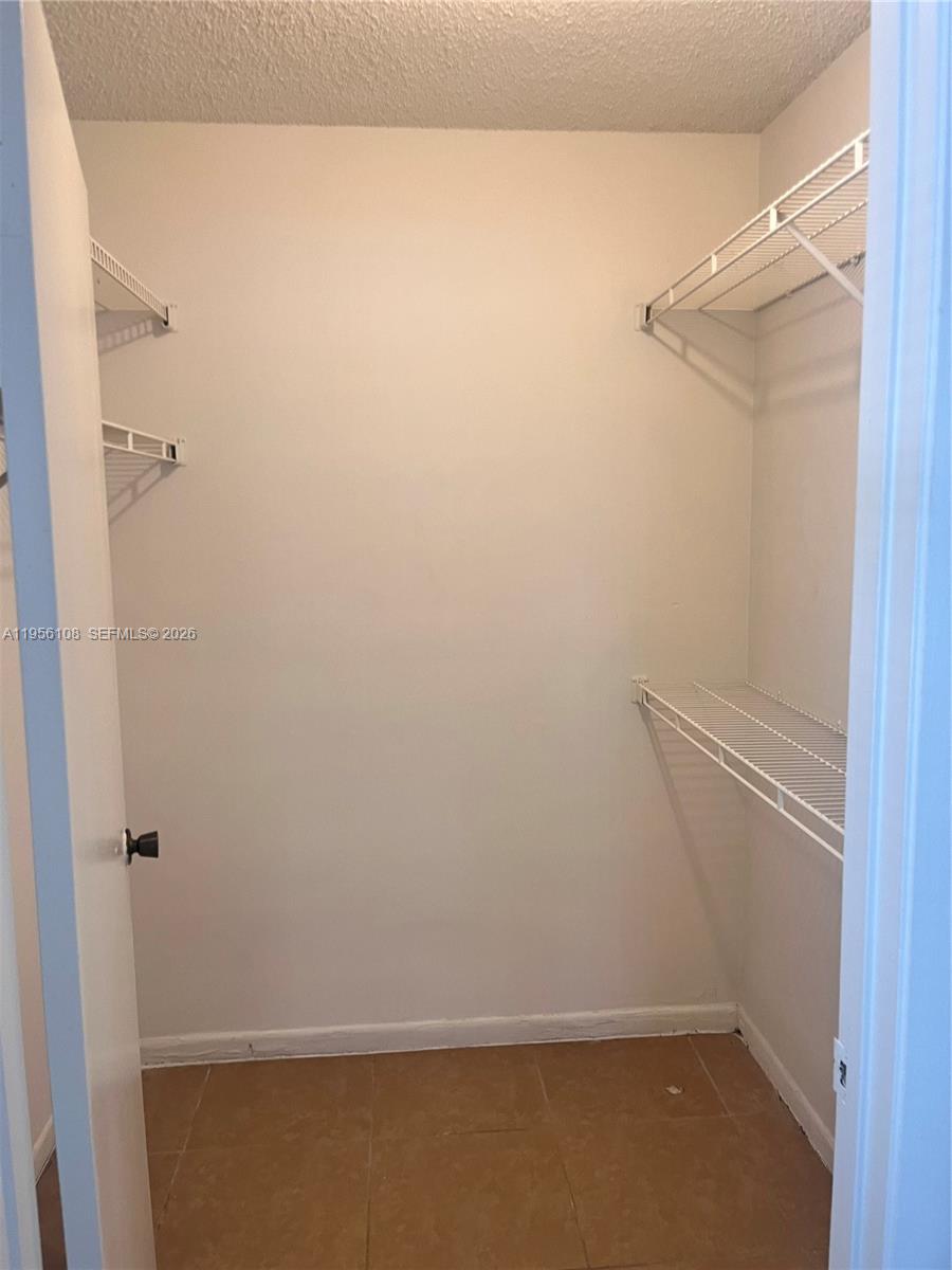 4281 West McNab Road, Unit 10 Pompano Beach, FL 33069 - Photo 9 of 16 a view of small space with racks on the wall