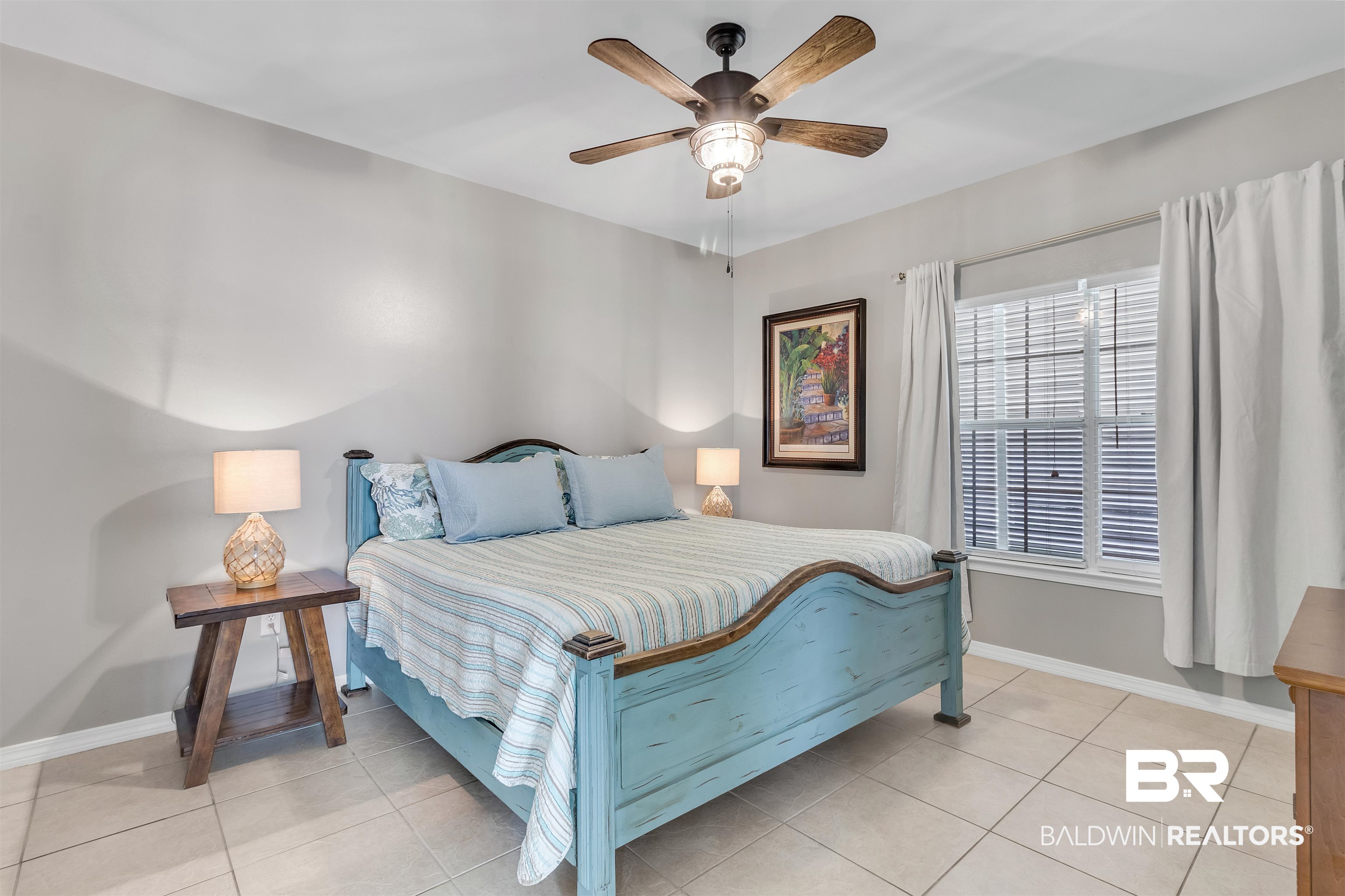 4324 B Lindsey Lane, Unit 4324B Orange Beach, AL 36561 - Photo 11 of 33 Bedroom with ceiling fan, baseboards, and light tile patterned flooring