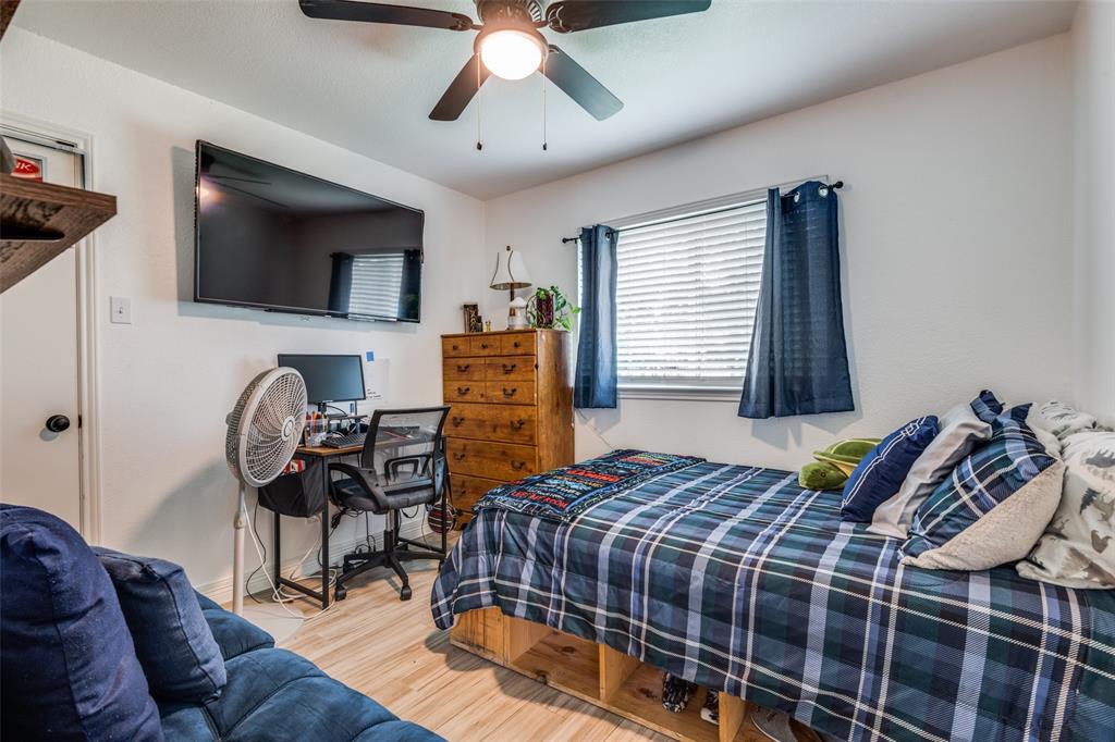 1301 Davis Lane Terrell, TX 75160 - Photo 28 of 37 a bedroom with a bed and ceiling fan
