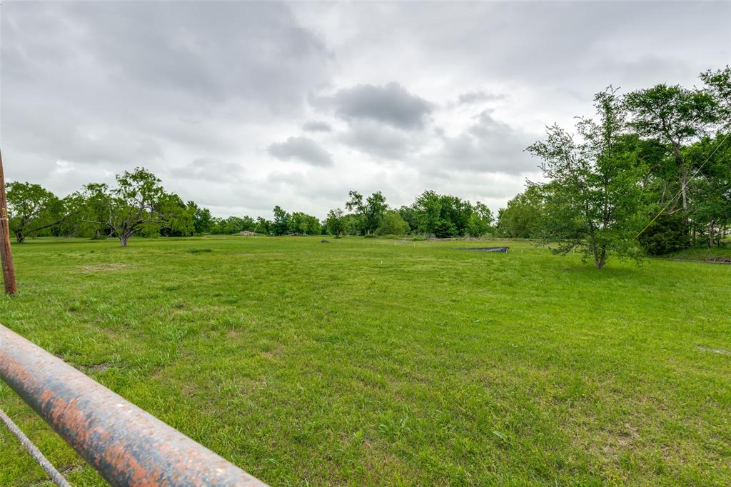 1301 Davis Lane Terrell, TX 75160 - Photo 33 of 37 a view of a grassy field with trees