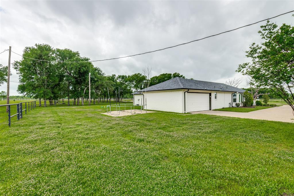 1301 Davis Lane Terrell, TX 75160 - Photo 35 of 37 a backyard of a house with lots of green space