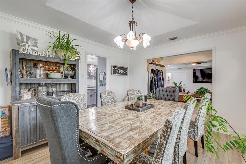 1301 Davis Lane Terrell, TX 75160 - Photo 8 of 37 a view of a dining room with furniture wooden floor and chandelier