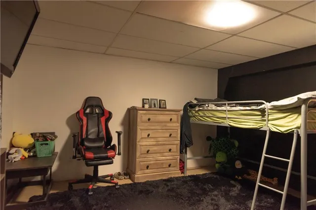 a view of walk in closet with clothes