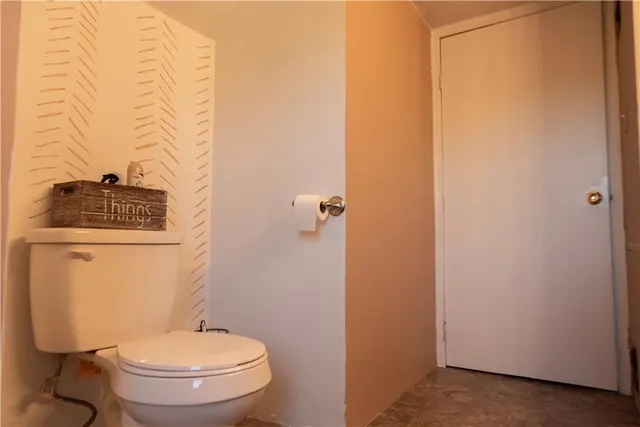 a bathroom with a toilet and a sink