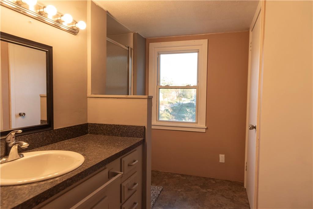 10395 Highway 85 Kittanning, PA 16201 - Photo 34 of 34 a bathroom with a granite countertop sink and a mirror
