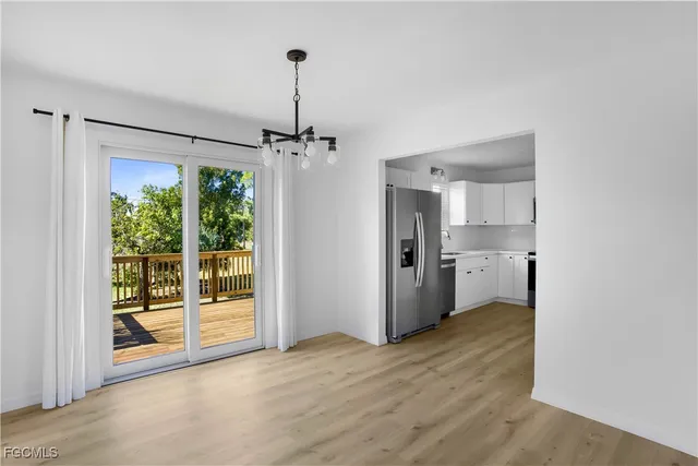 a view of a kitchen with a sink and a window