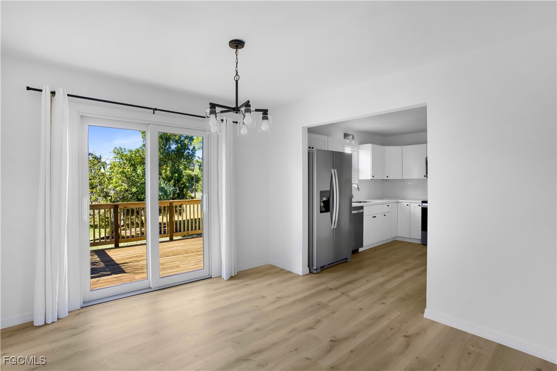 10697 Holly Road Bokeelia, FL 33922 - Photo 13 of 50 a view of a kitchen with a sink and a window