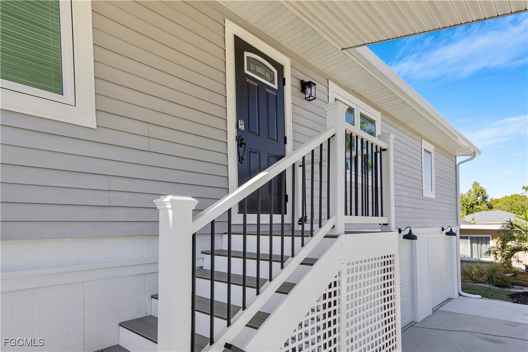 10697 Holly Road Bokeelia, FL 33922 - Photo 14 of 50 a view of a house with wooden floor and stairs