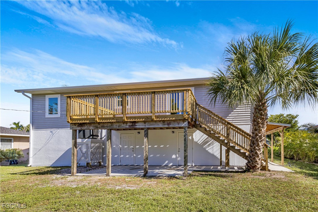 10697 Holly Road Bokeelia, FL 33922 - Photo 18 of 50 a view of a house with a small yard