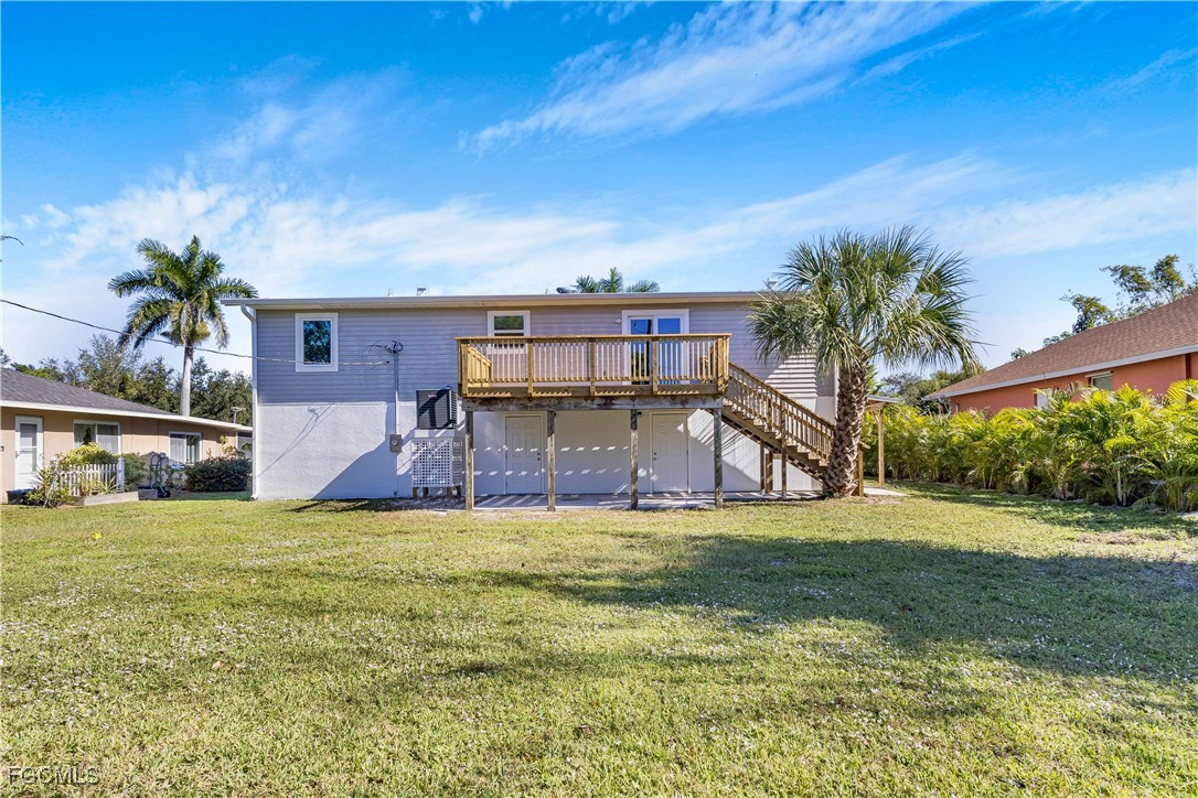 10697 Holly Road Bokeelia, FL 33922 - Photo 21 of 50 a view of a house with a yard