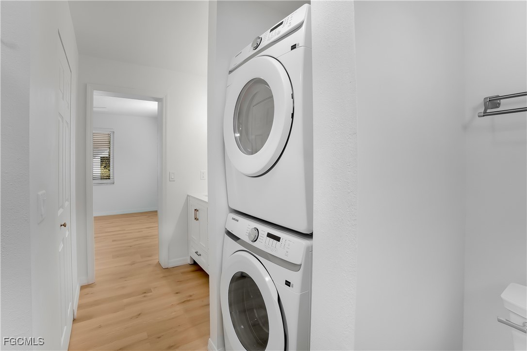 10697 Holly Road Bokeelia, FL 33922 - Photo 27 of 50 a view of a storage & utility room with a washer dryer