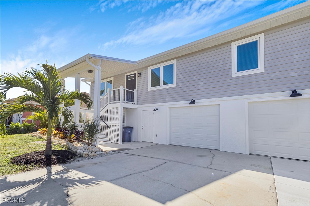 10697 Holly Road Bokeelia, FL 33922 - Photo 3 of 50 a view of a house with a backyard
