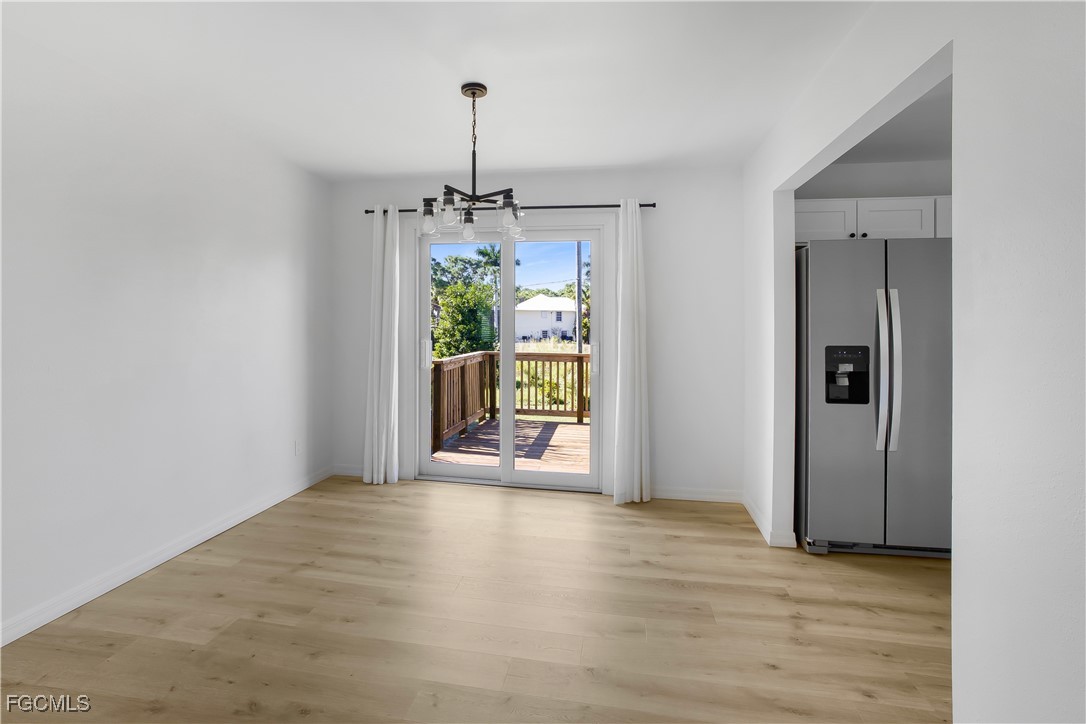 10697 Holly Road Bokeelia, FL 33922 - Photo 35 of 50 a view of an empty room with a window