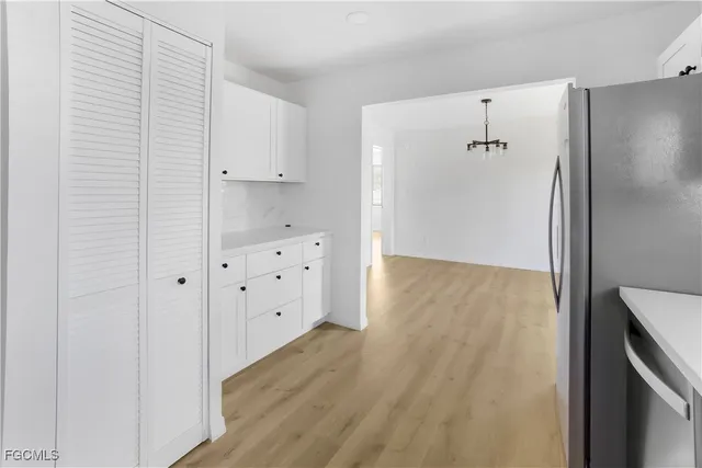 a view of hallway with wooden floor
