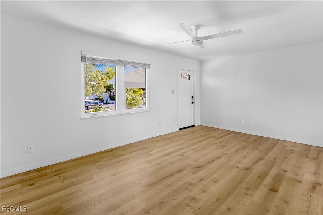 10697 Holly Road Bokeelia, FL 33922 - Photo 49 of 50 a view of an empty room with a window and a ceiling fan