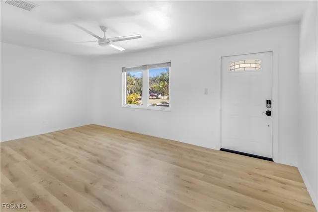 a view of an empty room with a window