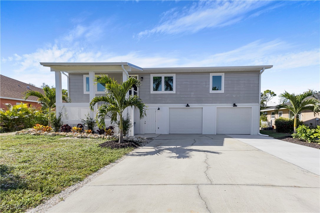 10697 Holly Road Bokeelia, FL 33922 - Photo 7 of 50 a view of a house with a yard