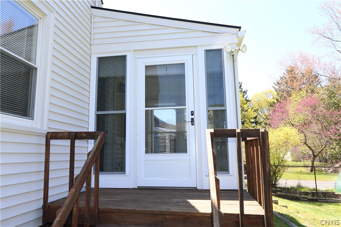 417 Radcliffe Road DeWitt, NY 13214 - Photo 23 of 29 The decking and stairs from the enclosed porch.