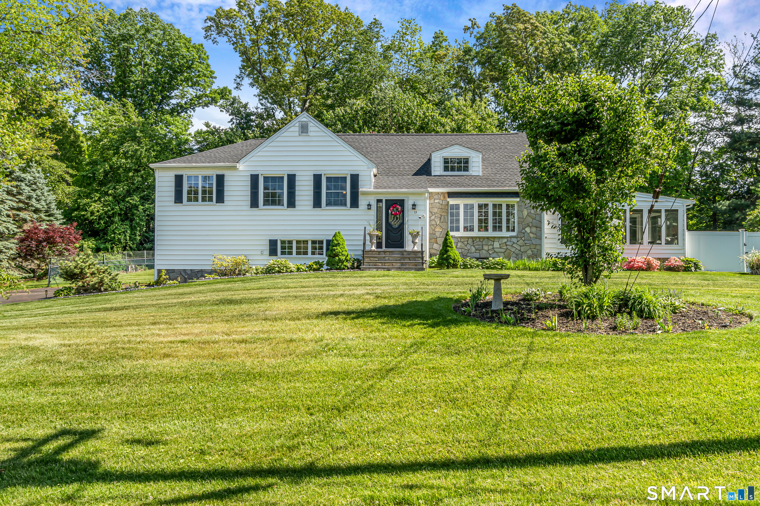 13 Pleasant Rise Circle Brookfield, CT 06804 - Photo 15 of 40 a front view of a house with a yard