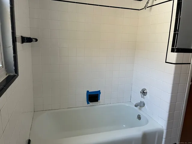 a bathroom with a bathtub