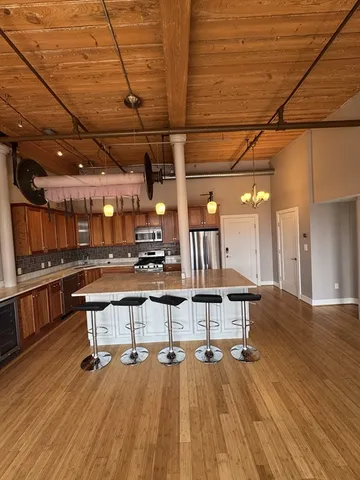 a view of a big room with wooden floor