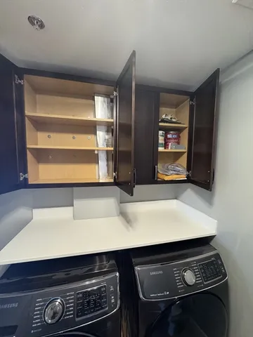 a view of appliances and cabinets