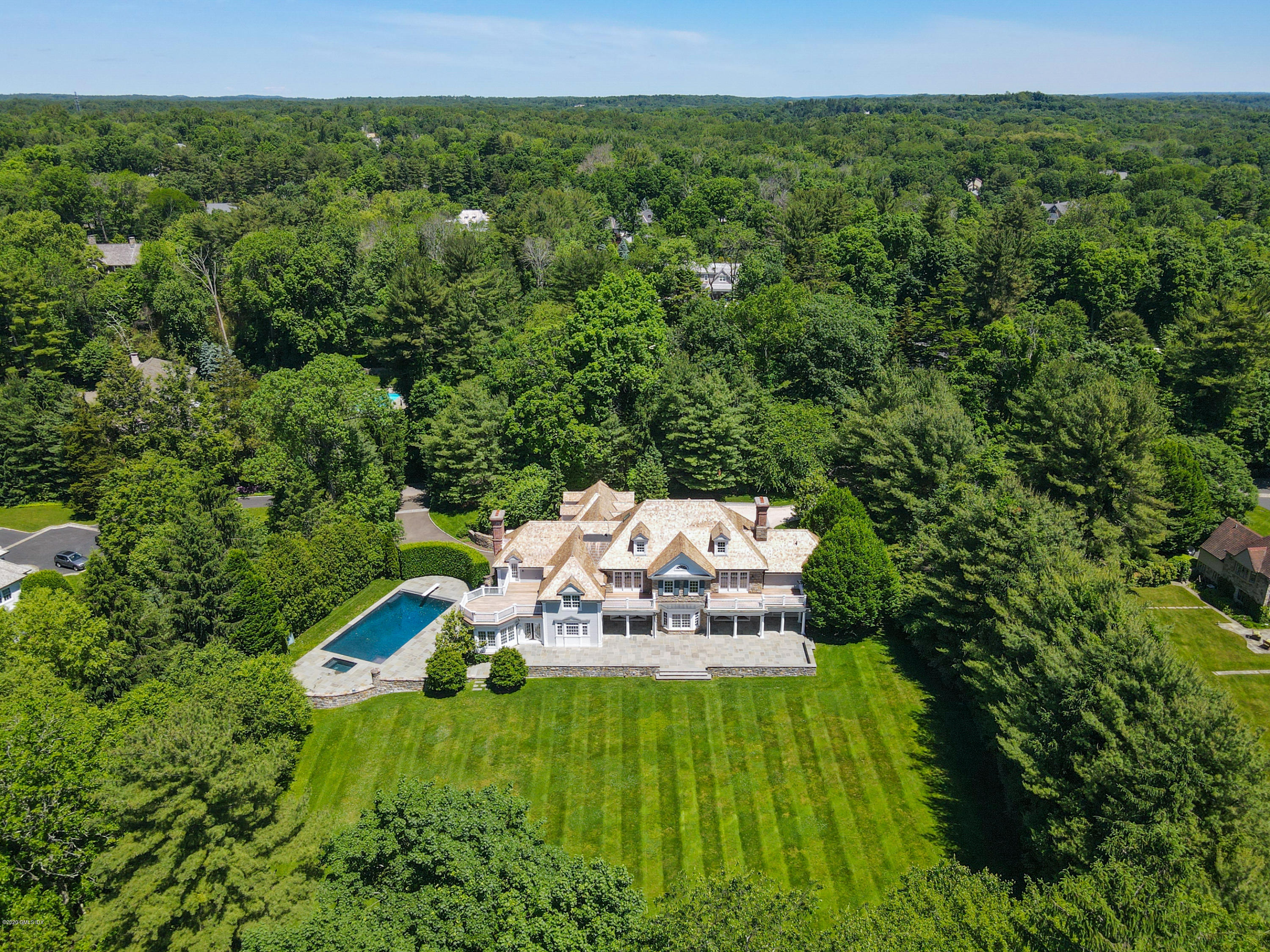 549 North Street Greenwich, CT 06830 - Photo 1 of 1 a backyard of a house with a yard