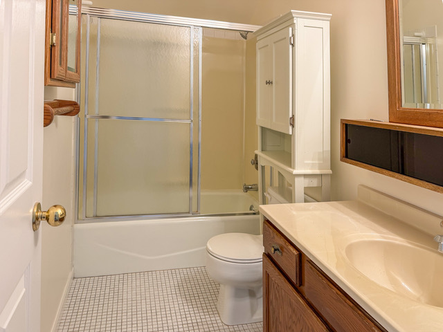 5090 Prairie Oak Road Gurnee, IL 60031 - Photo 13 of 30 a bathroom with a granite countertop sink toilet and shower