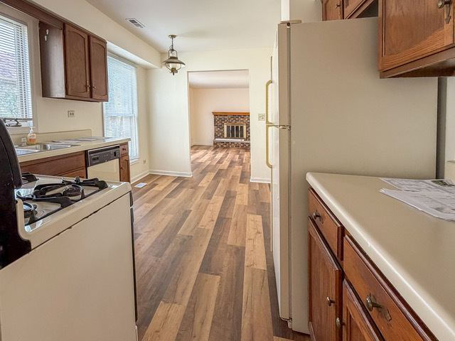 5090 Prairie Oak Road Gurnee, IL 60031 - Photo 15 of 30 a kitchen with a stove and a refrigerator