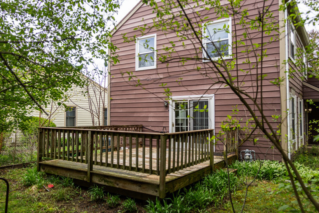 5090 Prairie Oak Road Gurnee, IL 60031 - Photo 30 of 30 a view of a house with a small yard and wooden deck