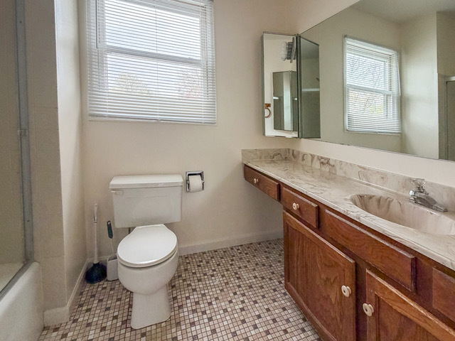 5090 Prairie Oak Road Gurnee, IL 60031 - Photo 5 of 30 a bathroom with a sink toilet and window