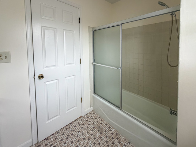 5090 Prairie Oak Road Gurnee, IL 60031 - Photo 6 of 30 a bathroom with a glass shower door