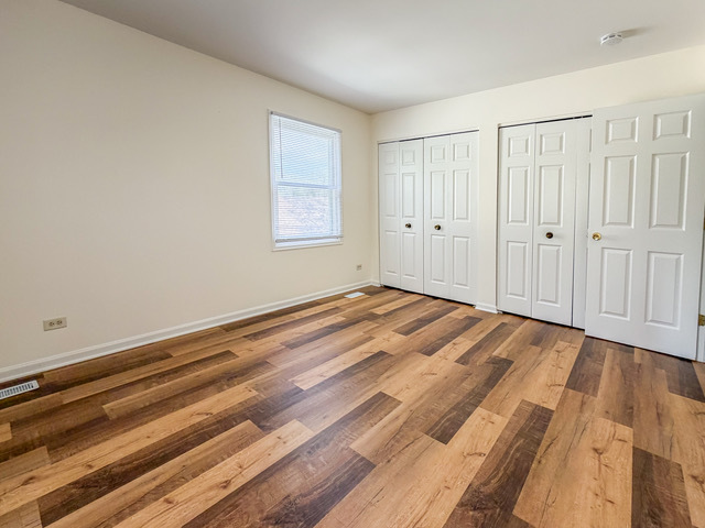 5090 Prairie Oak Road Gurnee, IL 60031 - Photo 9 of 30 a view of a room with wooden floor