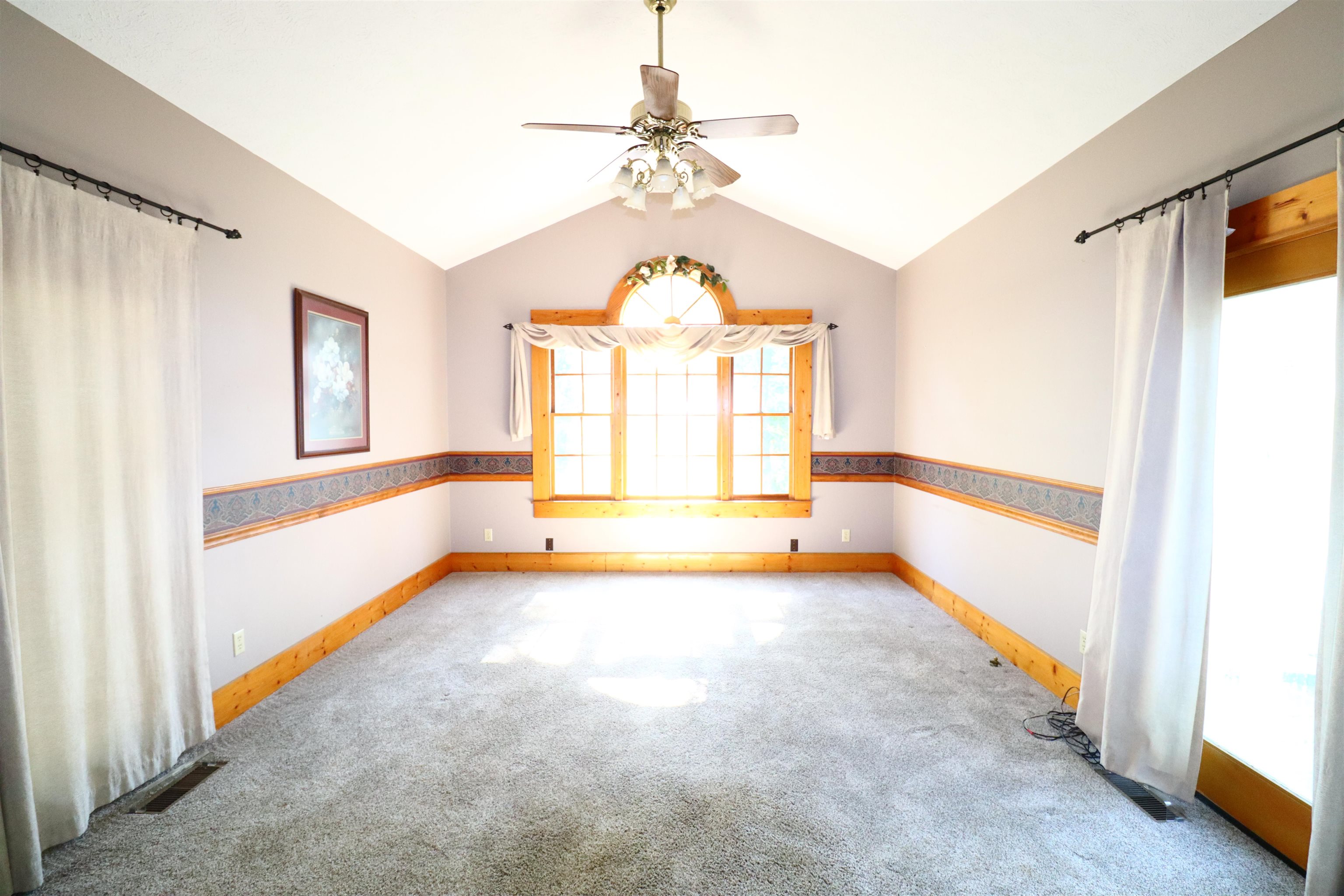 317 Purdy Road Selmer, TN 38375 - Photo 19 of 38 Carpeted spare room featuring lofted ceiling and ceiling fan