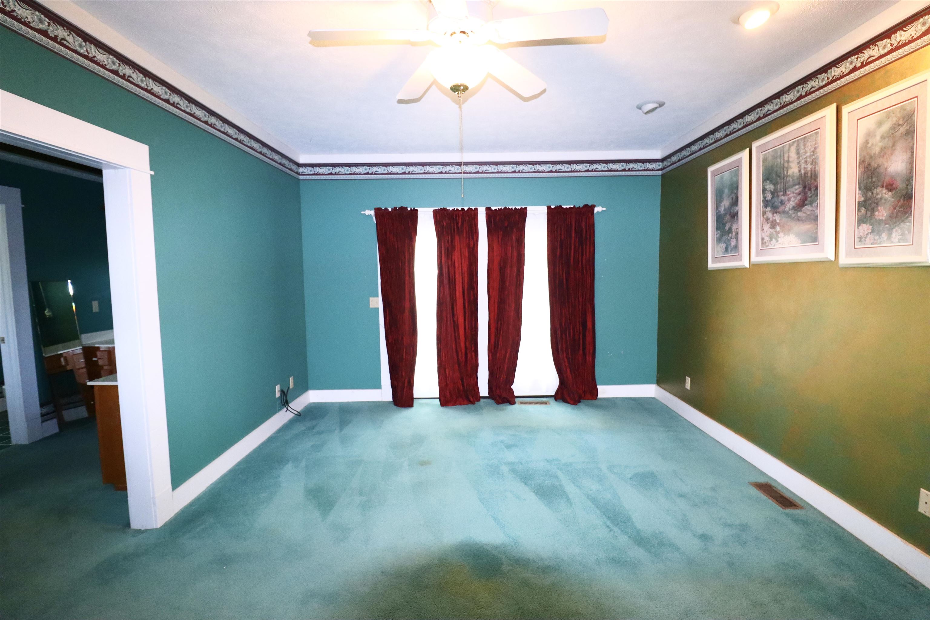 317 Purdy Road Selmer, TN 38375 - Photo 22 of 38 Unfurnished room featuring carpet flooring, ceiling fan, and ornamental molding