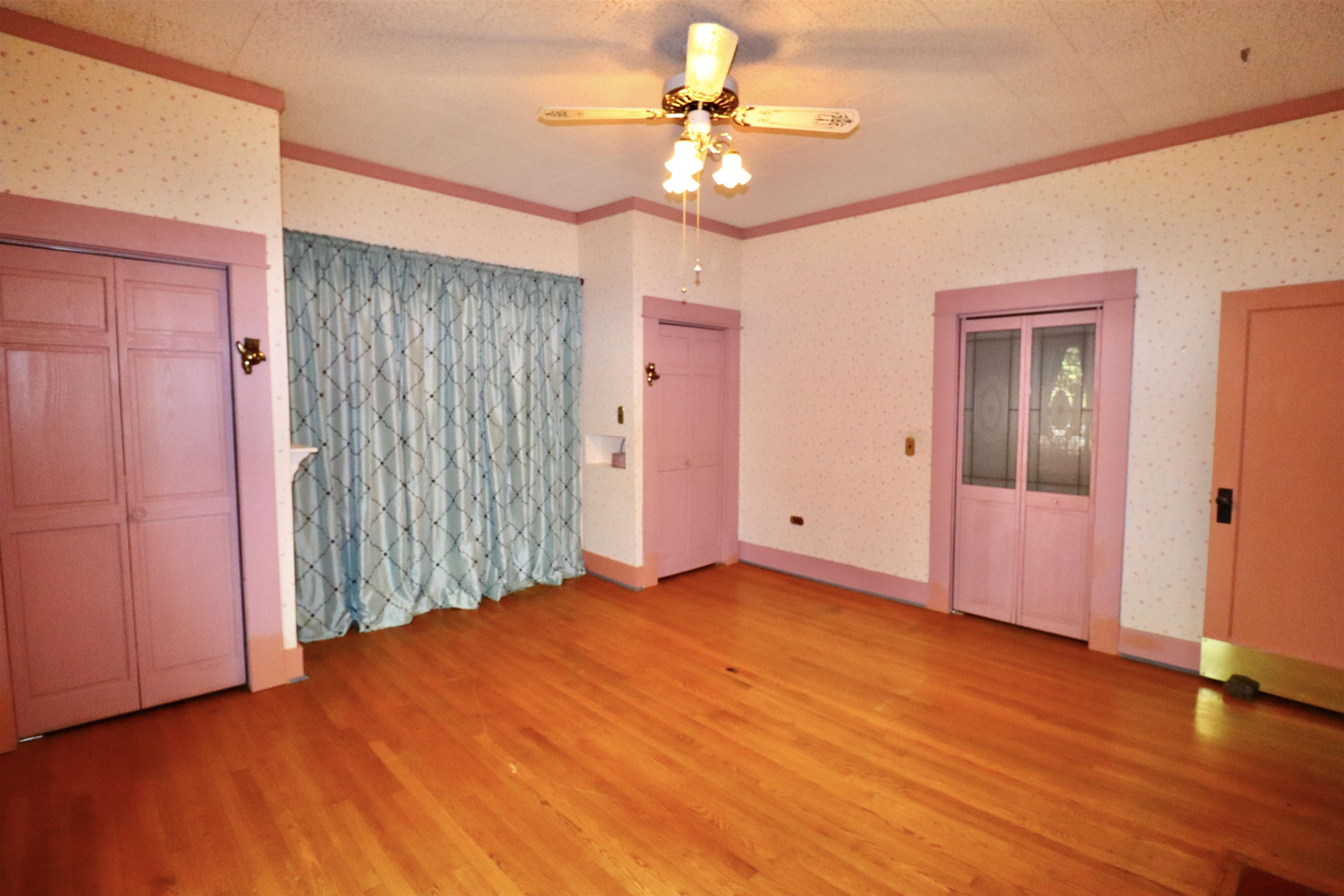 317 Purdy Road Selmer, TN 38375 - Photo 31 of 38 Unfurnished bedroom featuring wood-type flooring and ceiling fan