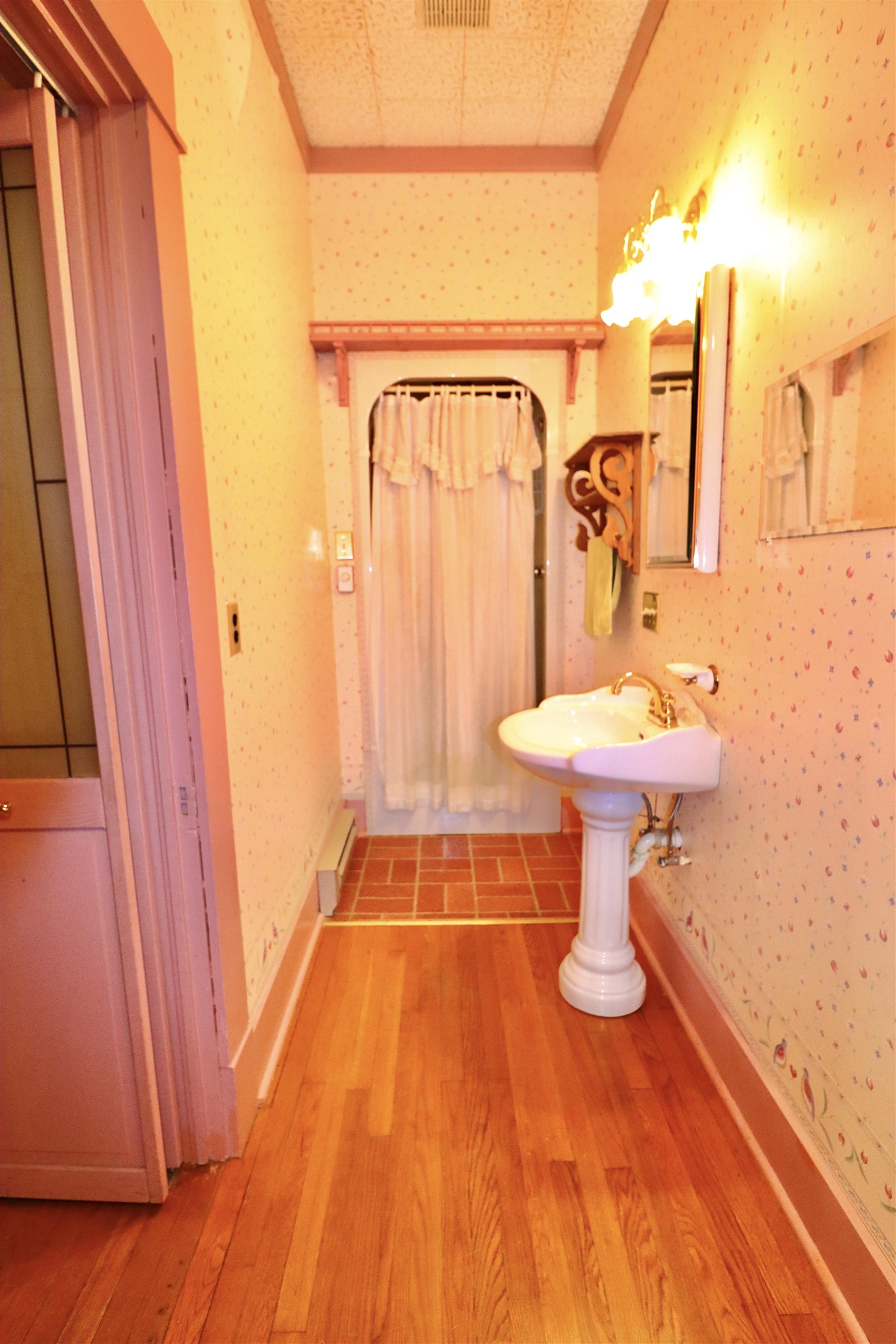 317 Purdy Road Selmer, TN 38375 - Photo 32 of 38 Bathroom featuring hardwood / wood-style floors, crown molding, and a textured ceiling