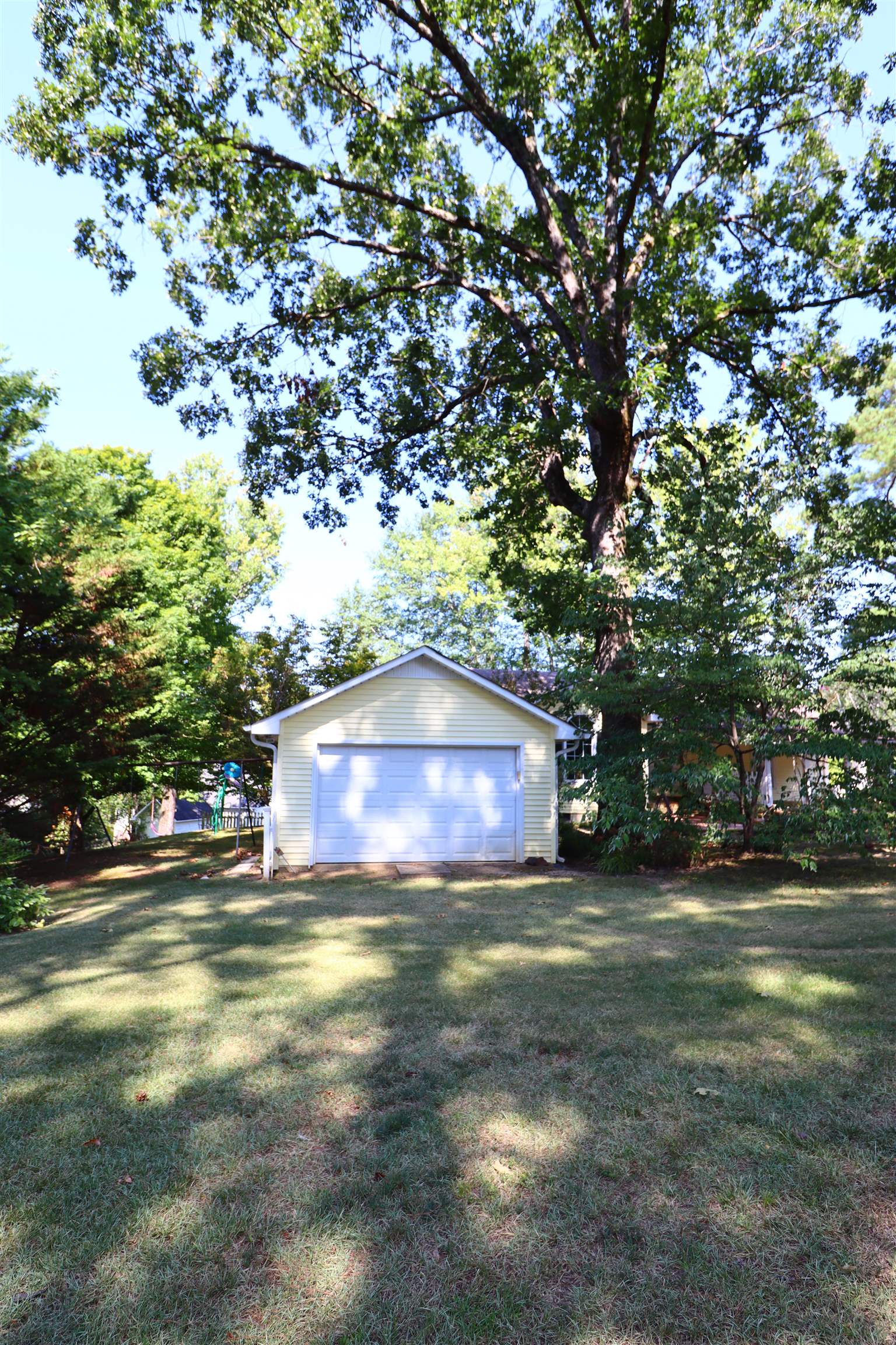 317 Purdy Road Selmer, TN 38375 - Photo 6 of 38 Exterior space featuring an outdoor structure and a garage