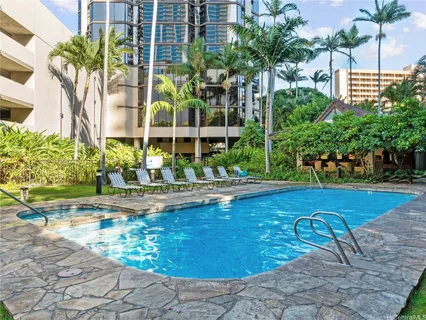 a view of swimming pool with a patio