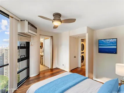 a bedroom with a bed and a view of bathroom