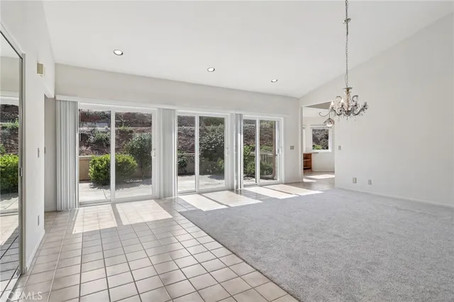 a view of a livingroom with a fireplace and window