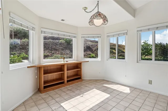 a kitchen with stainless steel appliances granite countertop a refrigerator a sink and a stove