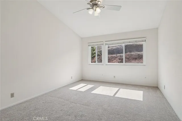 a bathroom with a granite countertop sink a mirror and shower