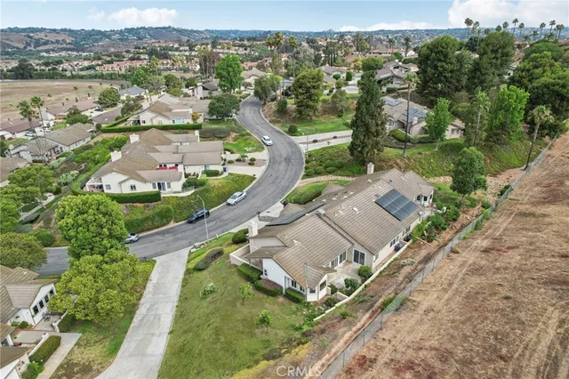 a view of a house with garden and a yard